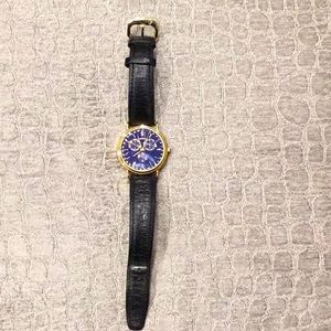Movado Men’s Blue Face Gold Case Watch